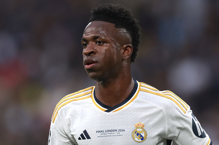 Vinícius Júnior in a white Real Madrid soccer jersey during a match